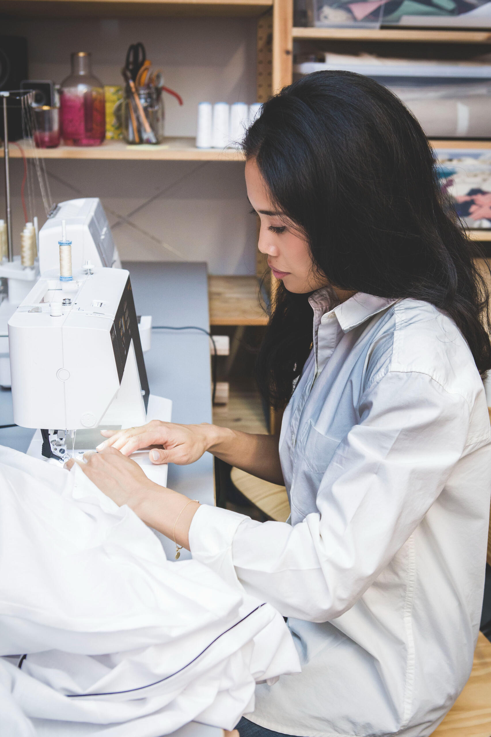 Woman sewing curtains and soft furnishings